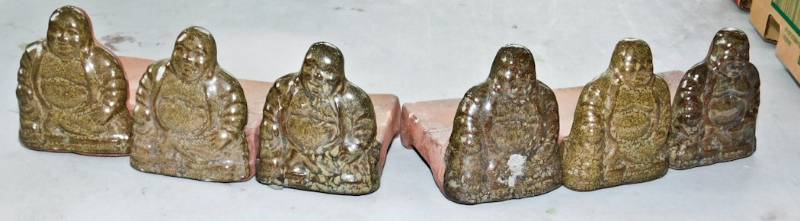 lot 54 image: 6 terra cotta Glazed Buddha plant feet