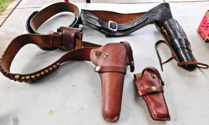 lot 59 image: vintage leather gun belts and holsters