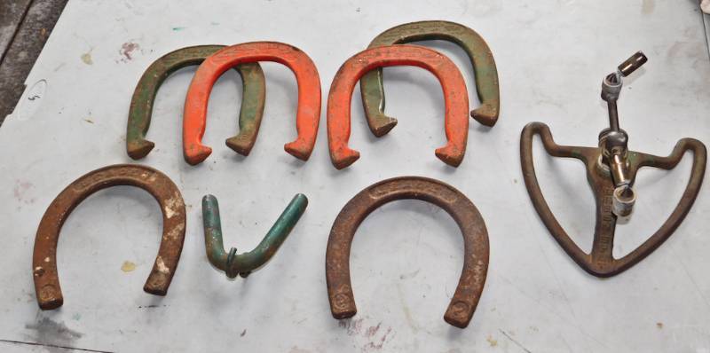 lot 77 image: cast horseshoes and water sprinkler