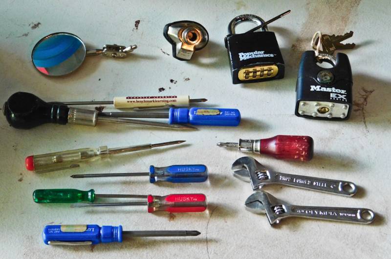 lot 33 image: padlocks, gun lock and mini tools