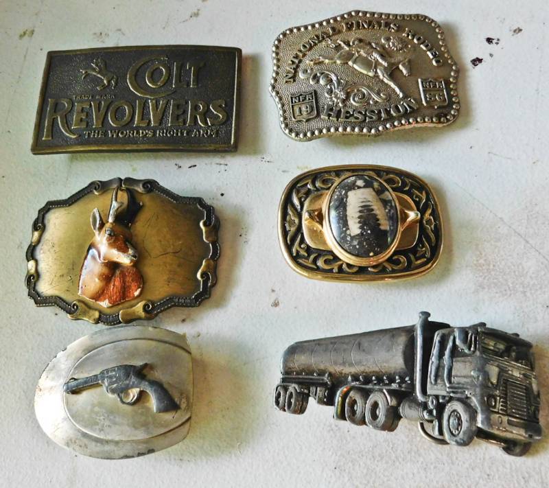 lot 32 image: 6 belt buckles some gun related