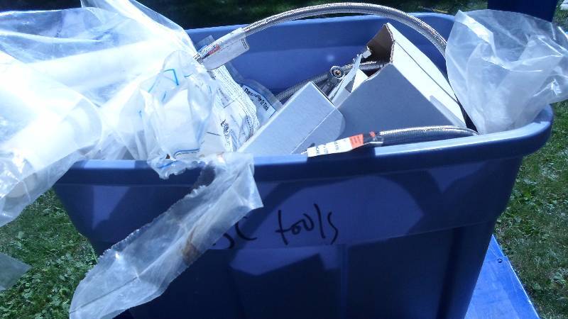 lot 21 image: Tote filled with plumbing items