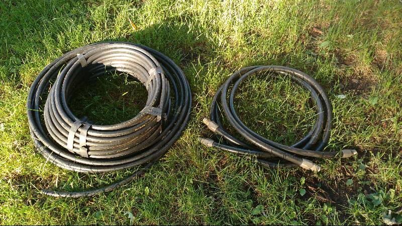 lot 107 image: Hard Plastic 12in Black Tube and Misc. Flexible Hose with Coupling
