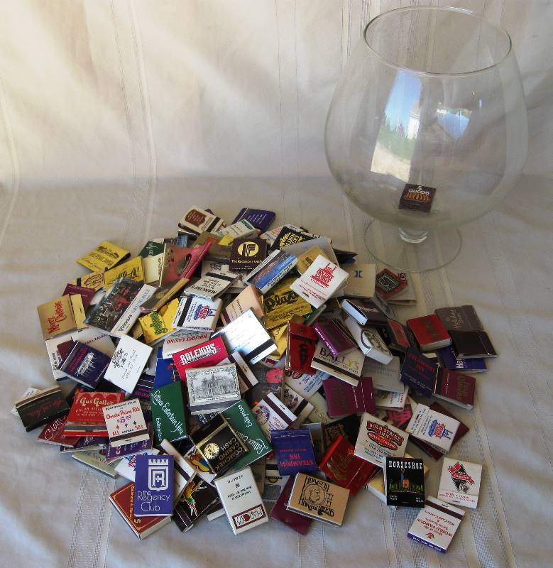 lot 112 image: Matchbook collection in Large, Stemmed, Glass Snifter