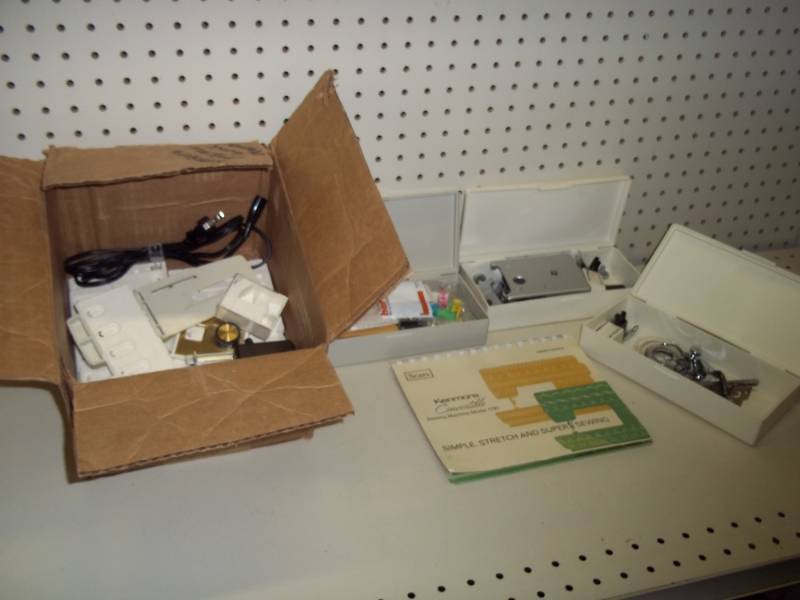 lot 225 image: Kenmore sewing machine accessories and parts