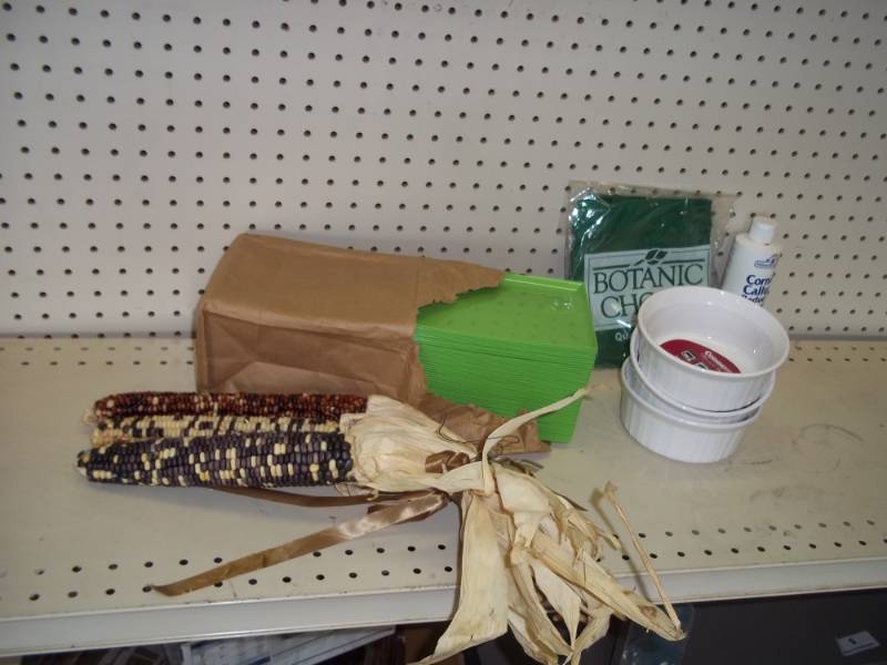 lot 231 image: Corning ware dishes, plastic plates and Indian corn