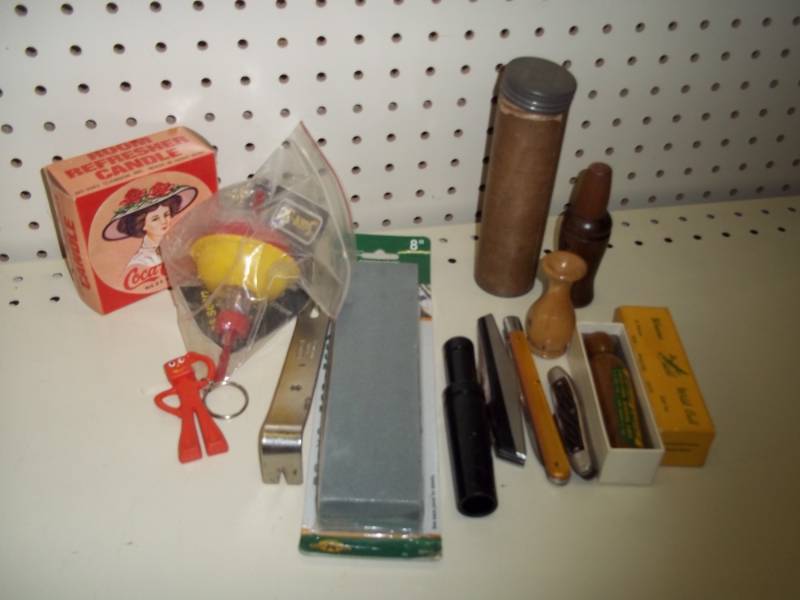 lot 262 image: Goose calls, Sharpening stone and bobber