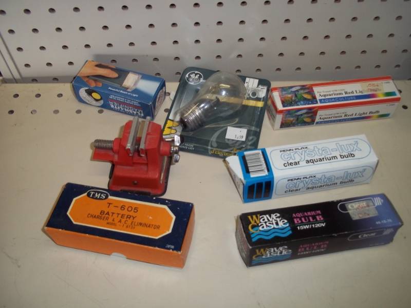 lot 293 image: Light bulbs, miniature vice and battery charger