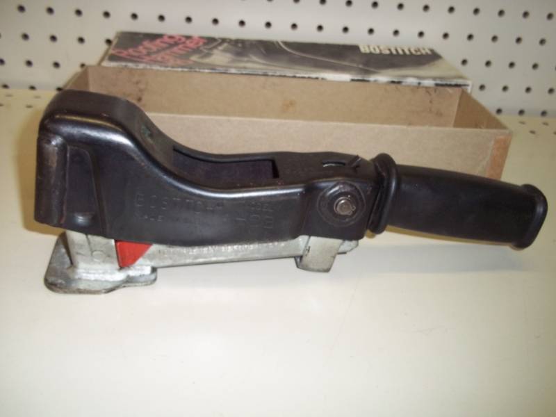 lot 355 image: Boss Stitch Roofing Hammer with box of staples