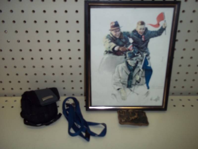 lot 357 image: Brass Buckle. Key Chain Holder, Camera Case, 8x10 Norman Rockwell Print