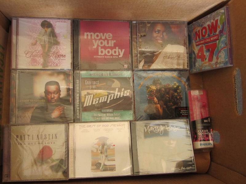 lot 64 image: Box of new CDs and earphones...