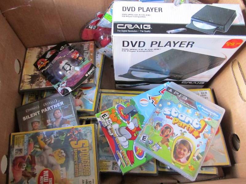 lot 75 image: Lot of DVDs , DVD player and more...