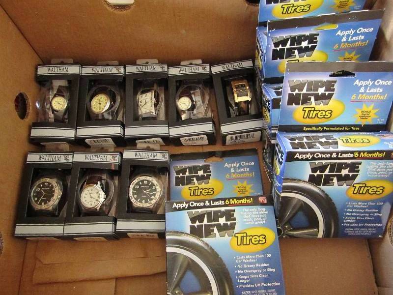 lot 83 image: Box of watches and tire wipes...