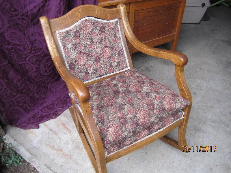 lot 24 image: Wood frame upholstered rocking chai...