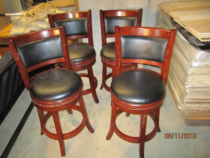 lot 29 image: 4 wood and vinyl upholstered swivel...