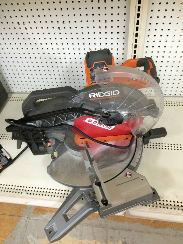 lot 115 image: Ridgid 15 Amp 12 in. Dual Bevel Miter Saw with Laser Model # R4122 in working conditions