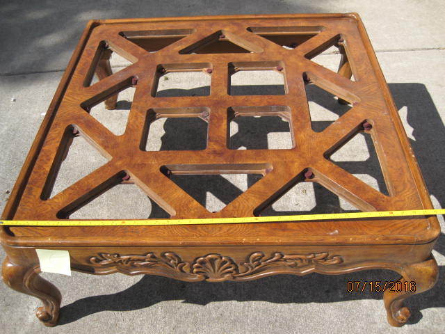 lot 19 image: Wooden Coffee Table missing glass for inserts.  42 square.