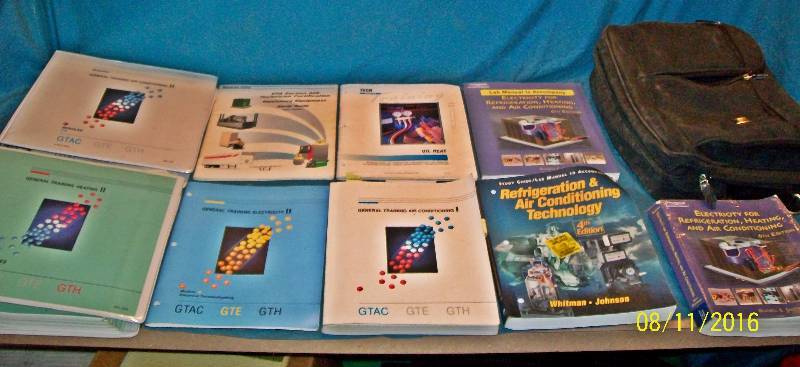 lot 27 image: Parcel  Zippered Computer Bag filled with 7 HVAC Heating & Air Conditioning Manuals.
