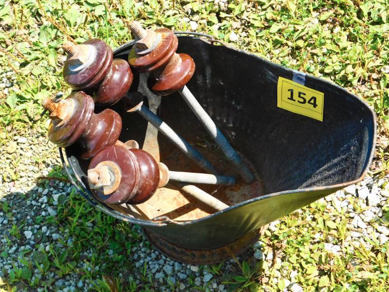coal pail and 4 insulators on posts