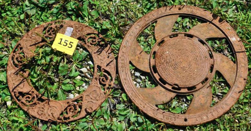 two round rusty metal items