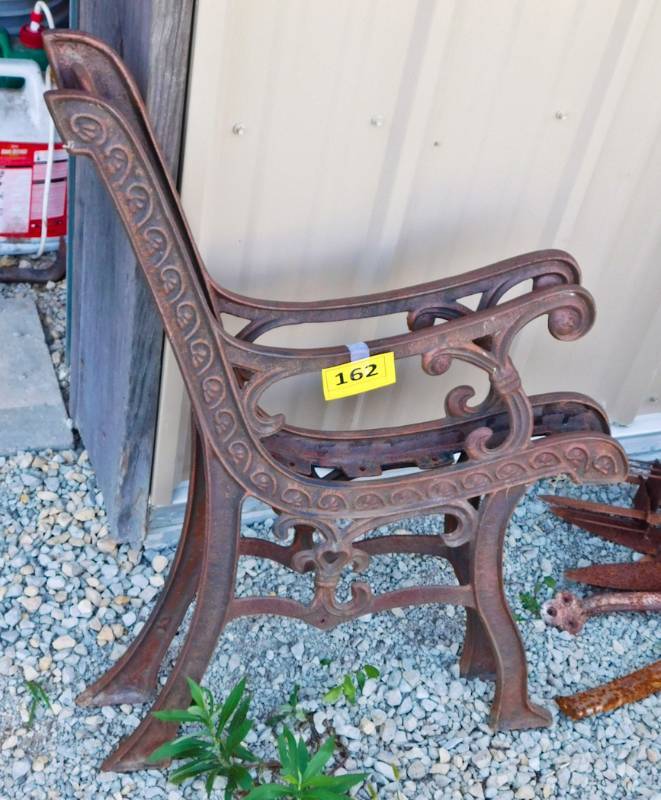 pair of cast iron bench ends