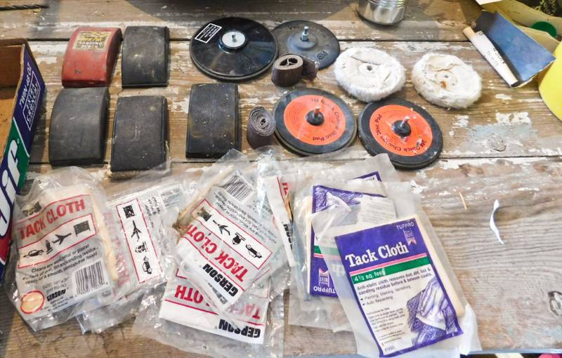 lot of sanding accessories and tack cloths