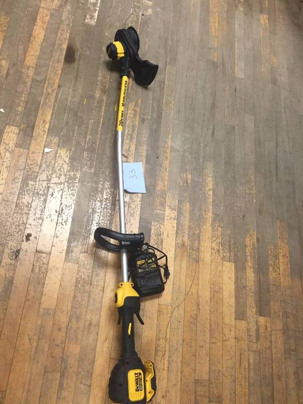 lot 33 image: Dewalt 20-Volt Max Lithium-Ion Electric Cordless Brushless String Trimmer DCST920 in like new condition Shaft slightly bent Battery and charger included