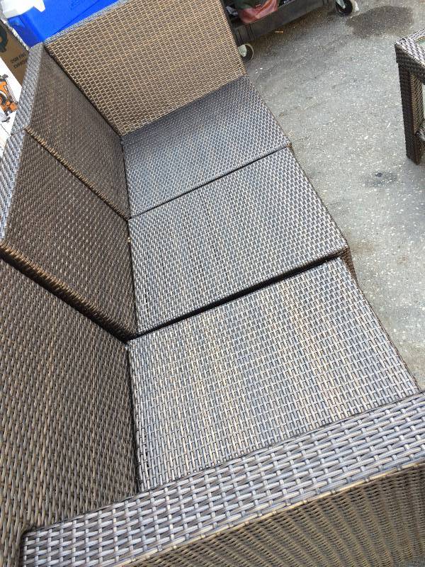 lot 138 image: PatioWicker set and Coffee table- slight damage on back leg see pictures- no cushions included