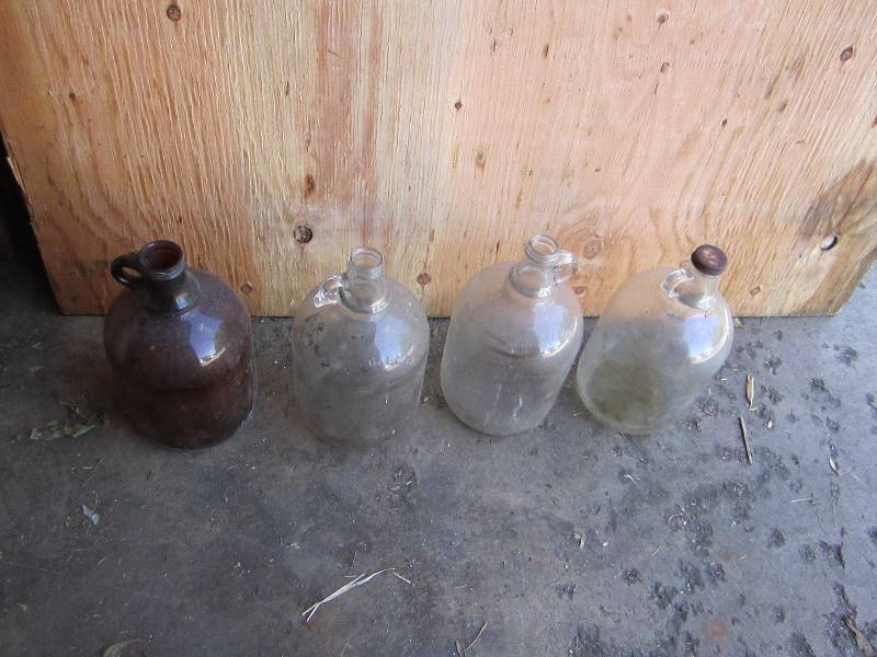 4 vintage glass gallon jugs...