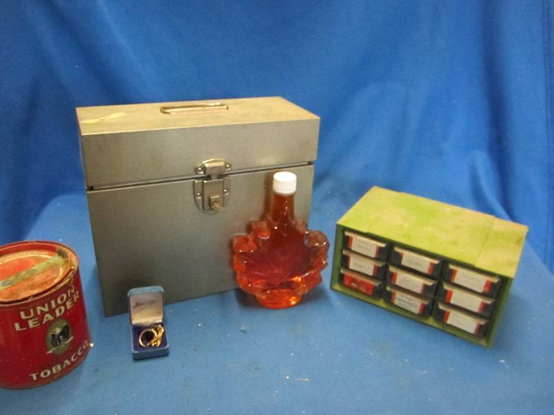 Small tool box, maple leaf bottle, ...