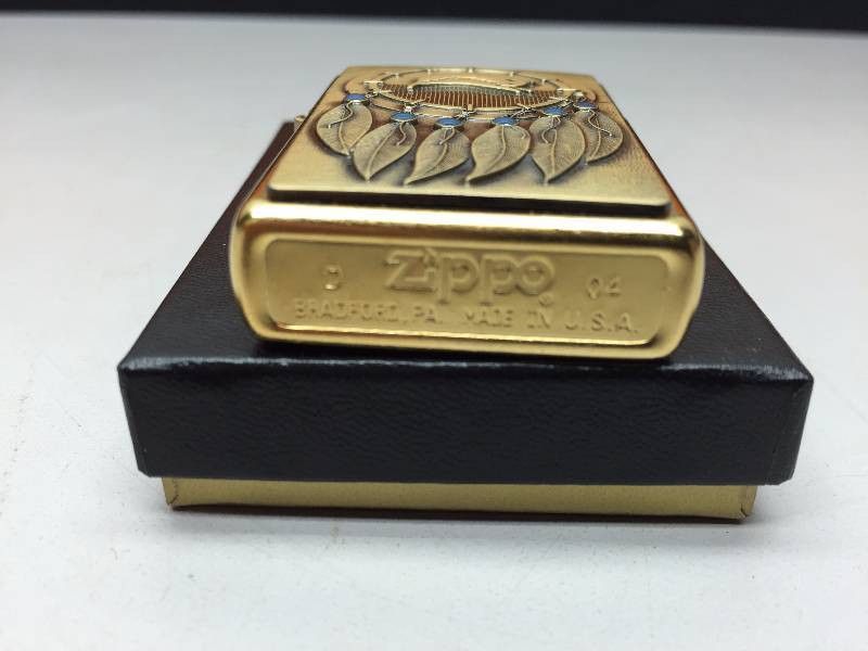 lot 70 image: BRASS ZIPPO LIGHTER (HORSESHOES)