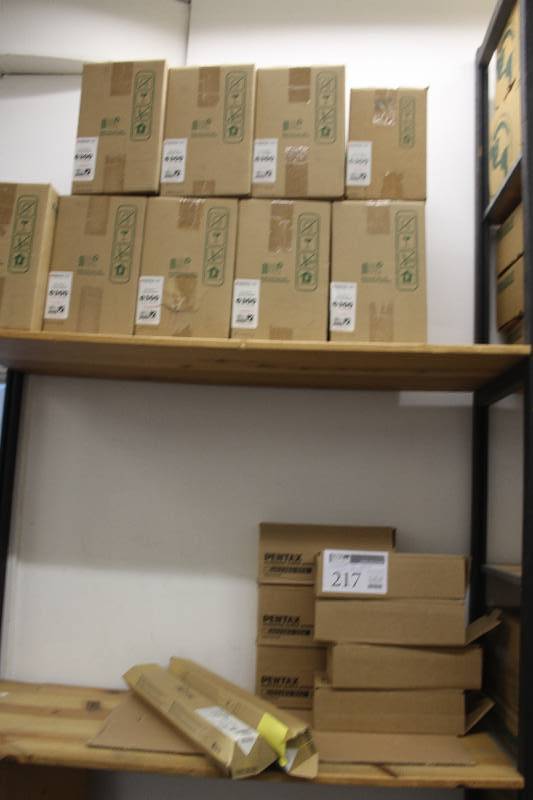 lot 217 image: Contents of Rack, Laser Printer Cartridges Including Okidata 6300, Ricoh C3000A Yellow, Pentax PocketJet Mobile Printer Mount