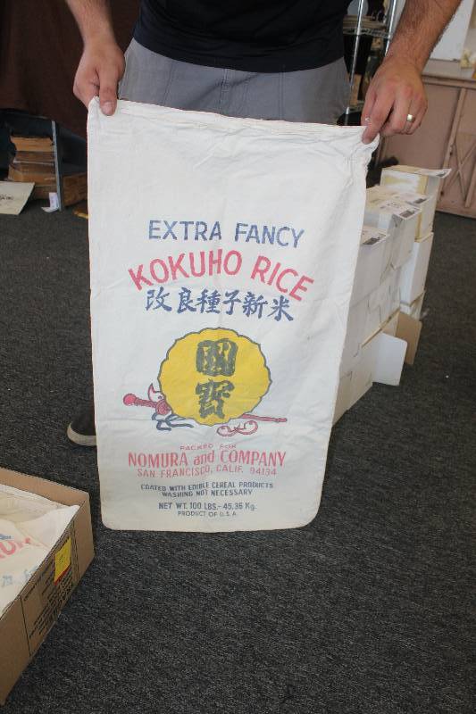 lot 184 image: Box Lot of 100 lbs Rice Bags