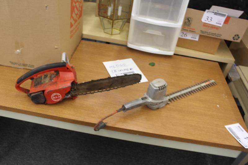 lot 66 image: Lot of (2) Lawn Equipment Including 1) Homelite XL2 Automatic Chainsaw AND 1) Black & Decker 8120 16 Deluxe Double Edge Shrub & Hedge Trimmer