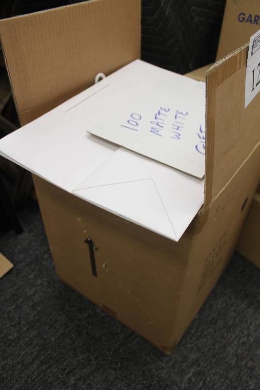 lot 129 image: Box Lot of Matte White Gift Bags