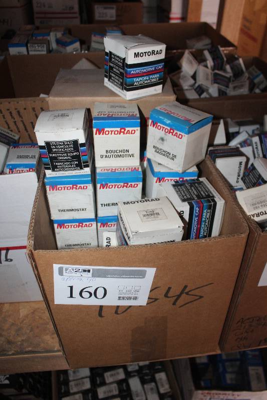 lot 160 image: Lot of (Approximately 40) MotoRad Thermostat, Gas Cap New In Box Includes T-39, MGC-825, 211-195