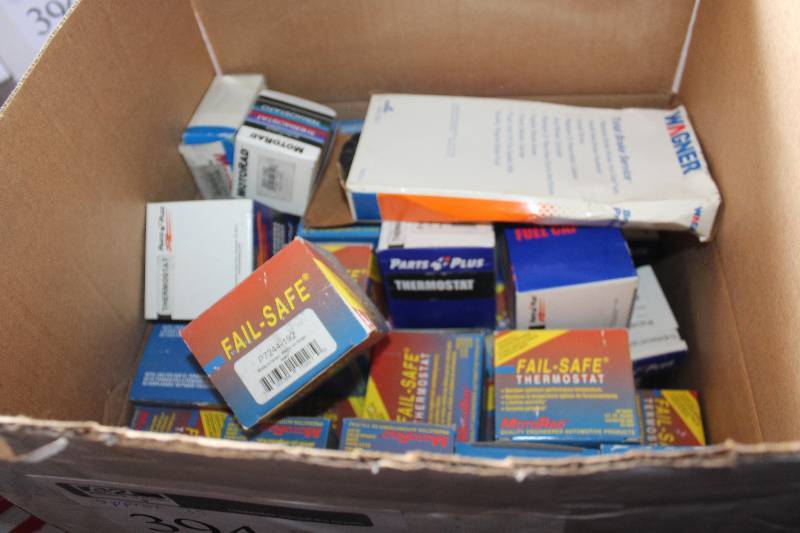 lot 394 image: Lot of (Approximately 35) Parts Plus, Wagner, Motorad, Motorad Gas Caps, Thermostat, Brake Parts New In Box Includes P7244-180, MGC-811, F110132, P7244, 207-192,