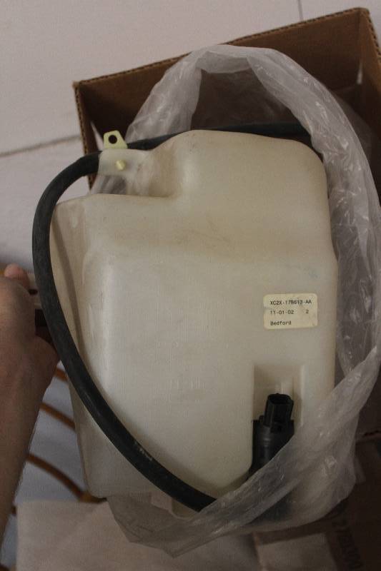 lot 572 image: Lot of (2) Boxes of Ford Windshield Washer Reservoir & Pump, Sender New In Box Includes F7UZ-17618-AE