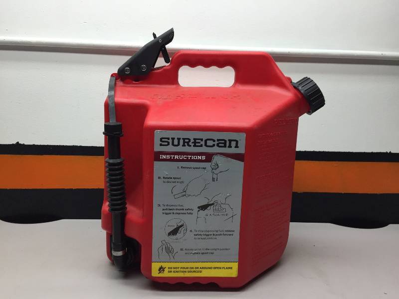 lot 34 image: SURE CAN 5 GALLON GAS CAN, GAS HANDS FREE