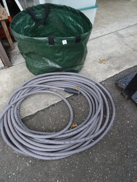 lot 100 image: Collapsible Leaf Bag, Soaker Hose,