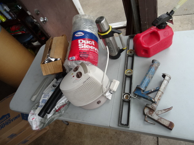 lot 129 image: Gas Can, Level, Black and Decker Heater