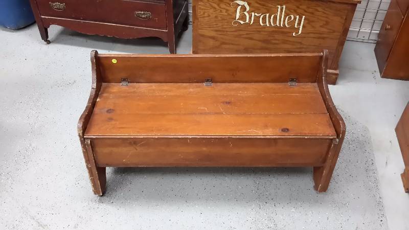 Antique wooden bench with hidden storage
