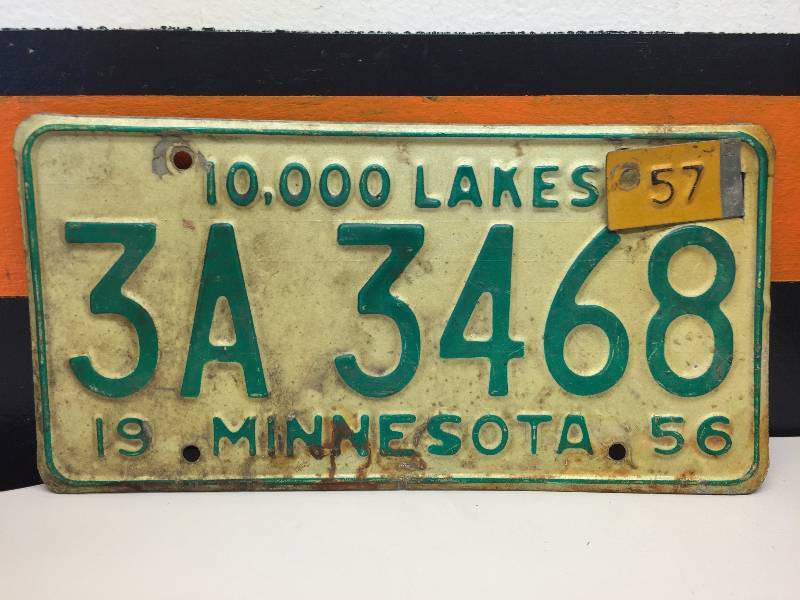 lot 11 image: BATTERY CHARGER, 1956 MINNESOTA VINTAGE LICENSE PLATE, NOS CYLINDER