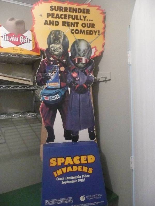 lot 13 image: CARDBOARD MOVIE ADVERTISEMENT FOR SPACE INVADERS- SURRENDER PEACEFULLY Approx 2ft wide 5ft high