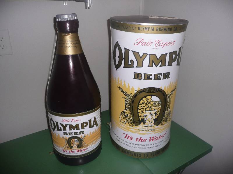 lot 32 image: VINTAGE BLOW UP OLYMPIA BOTTLE & CAN - Approx 24in high 12in wide