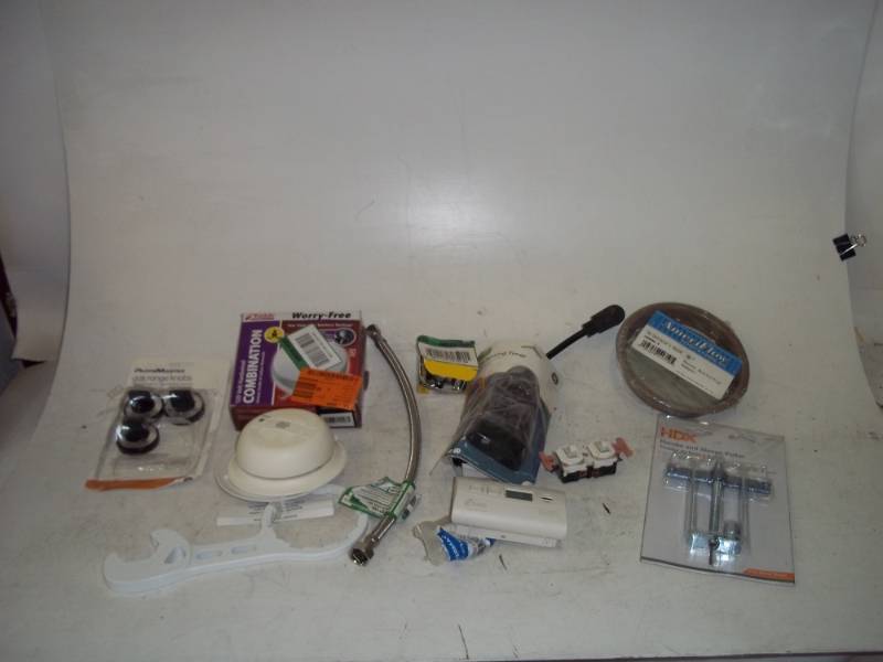 lot 17 image: Fire detectors, plumbing parts, light sensor timer