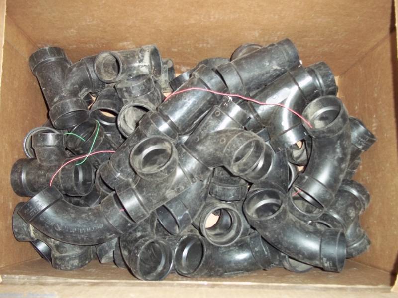 lot 25 image: New Large Box of Black PVC Plumbing Fittings