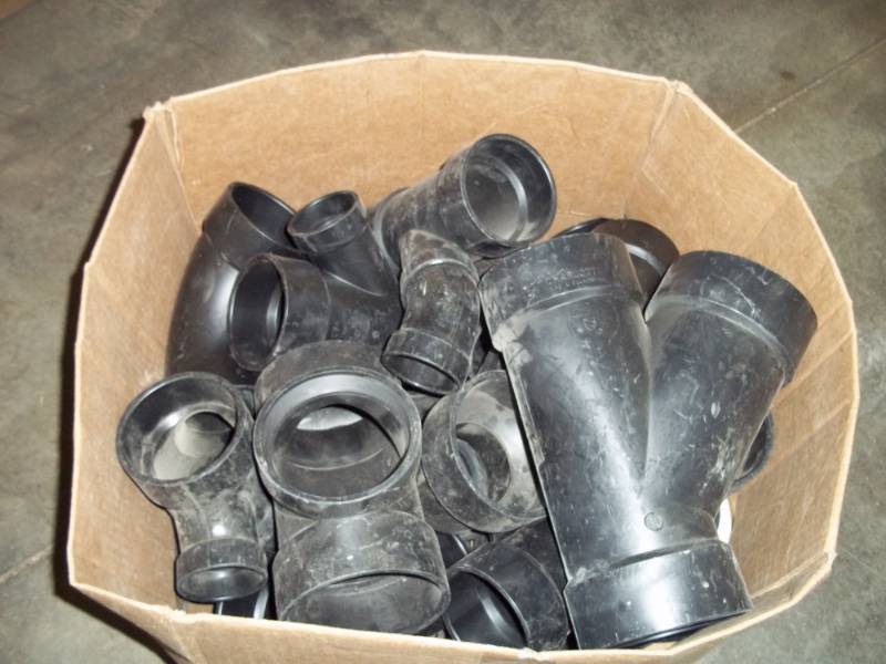 lot 27 image: New Box of Black PVC Plumbing Fittings