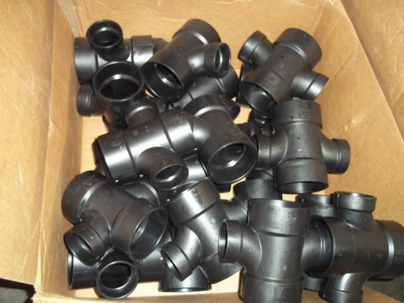 lot 30 image: New Box of Black PVC Plumbing Fittings