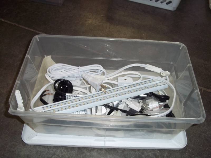 lot 245 image: Plastic Storage tote with supplies